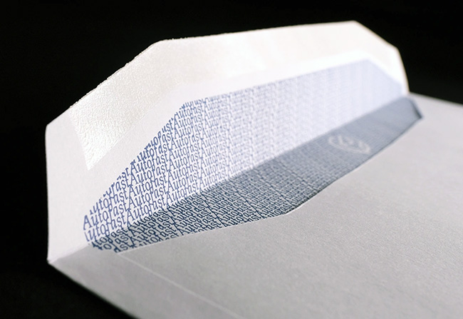 Close-up of gummed machinable flap on white 90gsm custom printed envelope by TradePrintingUK.com, showing blue hatched security pattern for content privacy and machine insertion in PPI postage or bulk mail-outs.