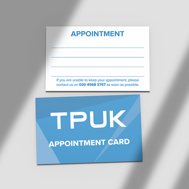 Custom printed Appointment card by TradePrintingUK.com, showing both front and back sides on a neutral background. The front has bold blue APPOINTMENT heading, blank lines for date and client details, and cancellation instructions with a London telephone phone number. The reverse displays APPOINTMENT CARD branding in white against a blue design, suitable for beauty salons, hairdressers, dental or health clinics, and service businesses.