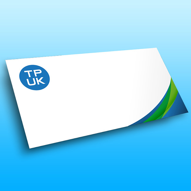 White DL custom printed envelope by TradePrintingUK.com on blue background, featuring TPUK logo, blue and green wavy accents, and blank space for addressing professional letters or invoices in 110 x 220 mm size.